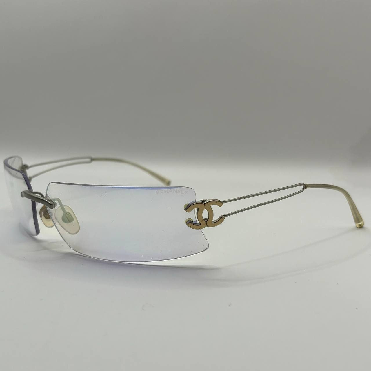 Chanel sunglasses vintage rimless frameless CC chameleon transparent blue glasses y2k with logo
