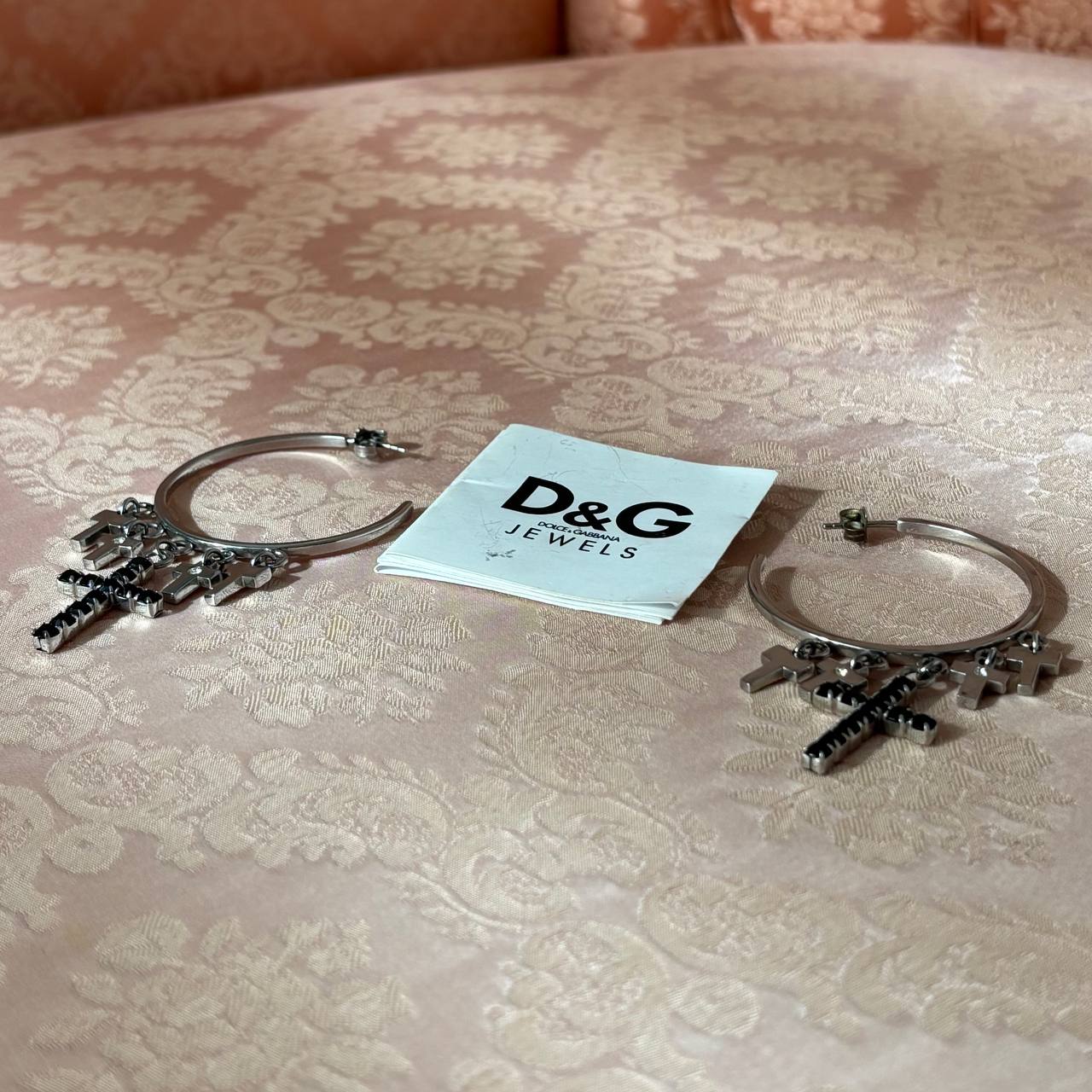 Dolce Gabbana hoop earrings with black crosses